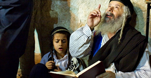 Two Orthodox Jews reading from a book