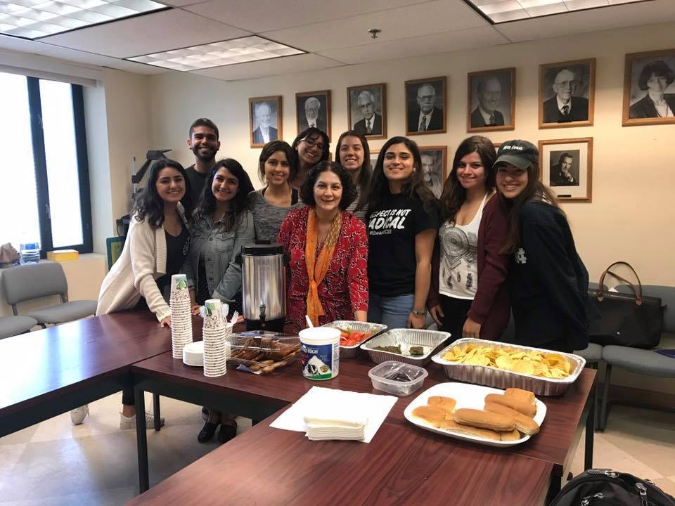 Students with Aazam Feiz at conversation table 17